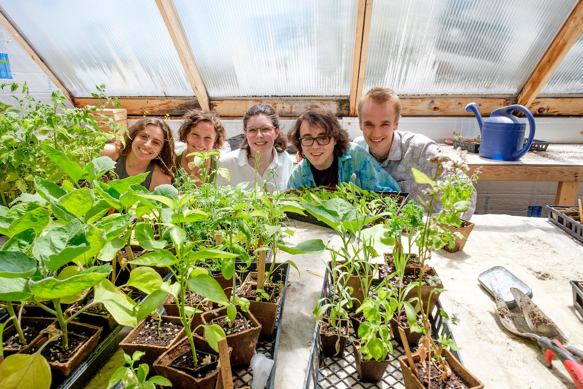 students posing in the College's garden