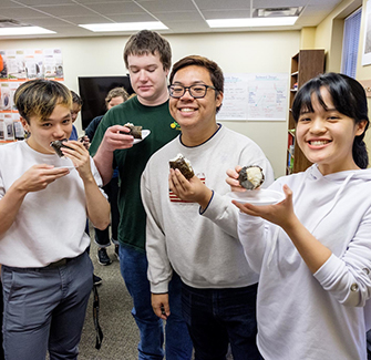 four K students eating homemade onigiri