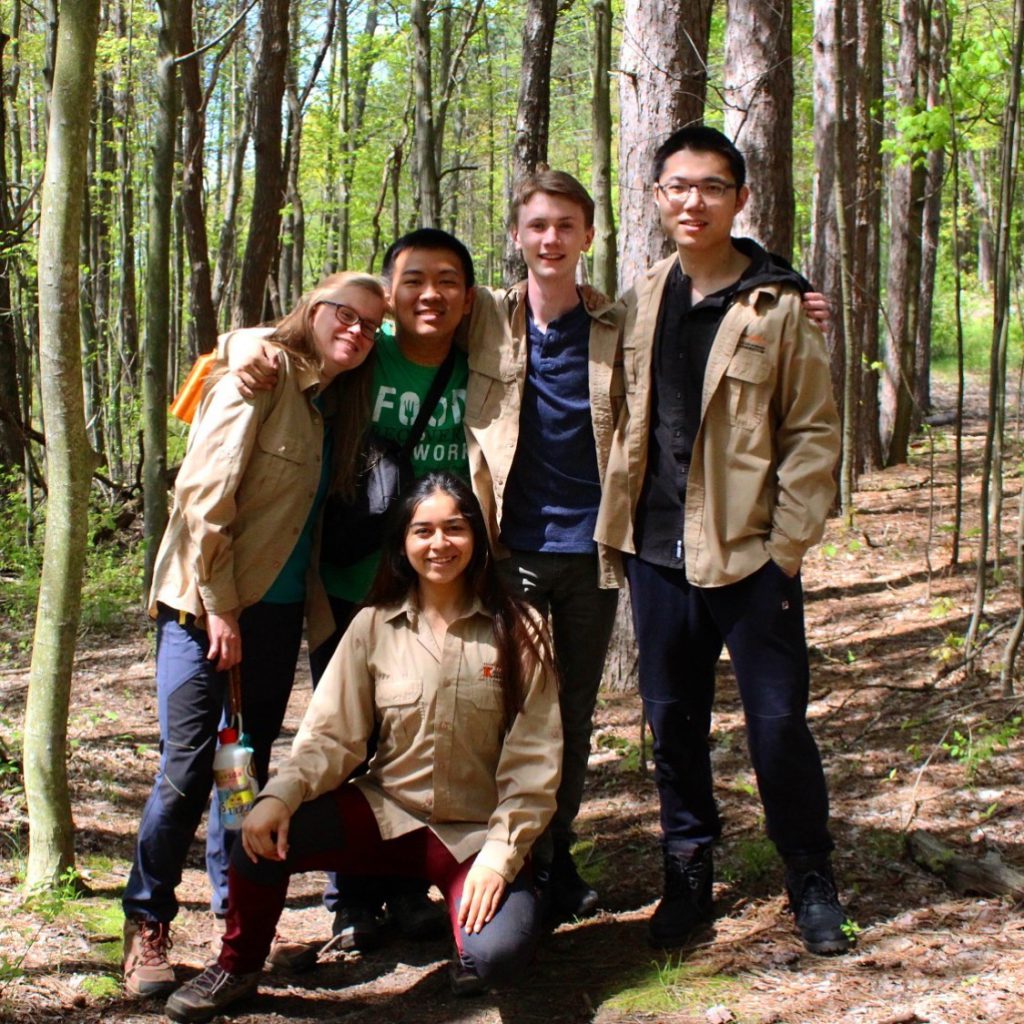 Student employees posing in the arboretum