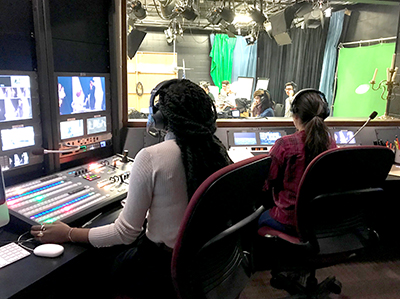 Kalamazoo College students working in the media studies studio