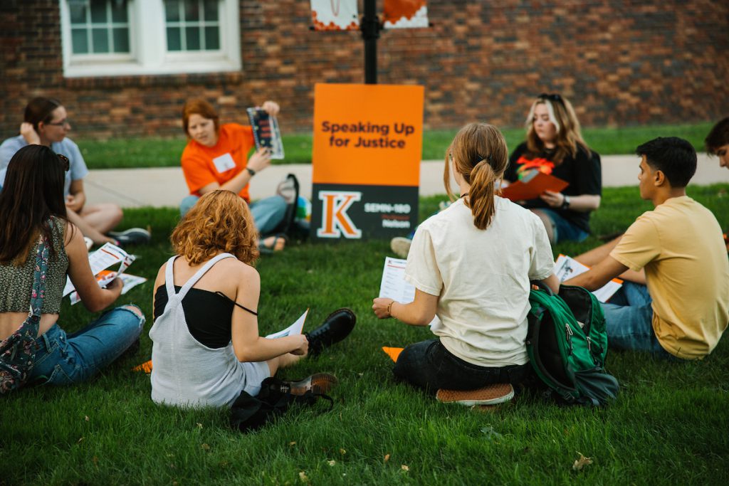 students sitting in a circle on the quad