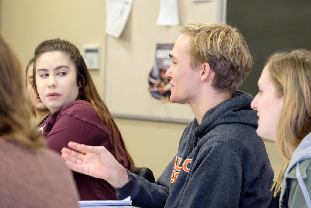 students participating in classroom discussion