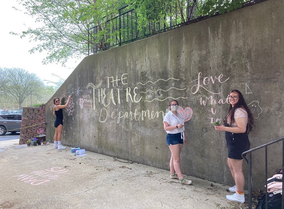 Theatre majors making a chalk mural