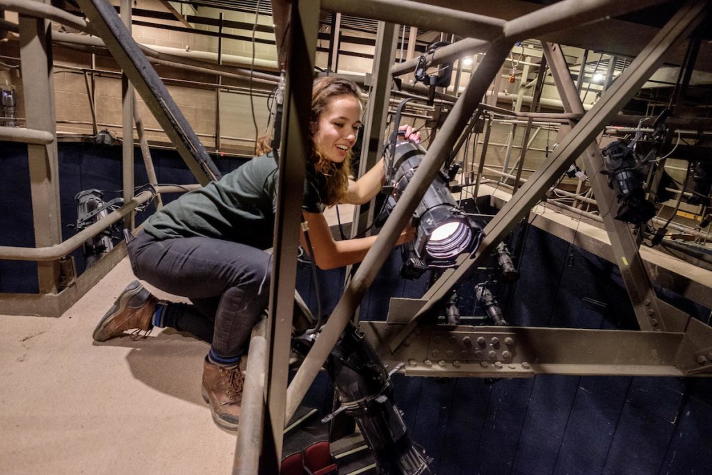 Student working theatre lighting