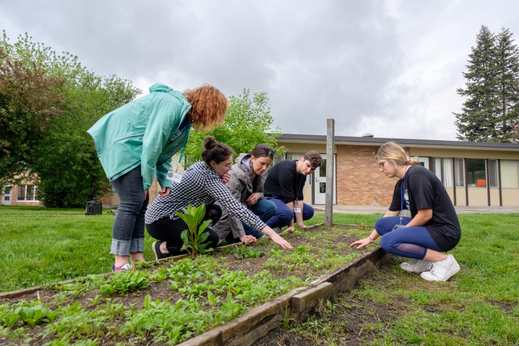 Students working with local gardeners