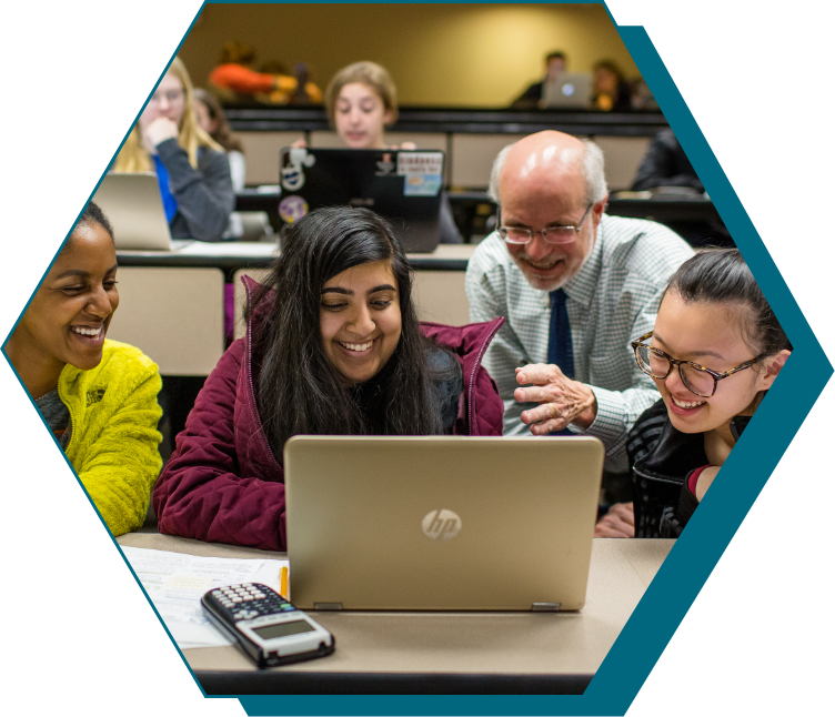 Students and teacher at the computer