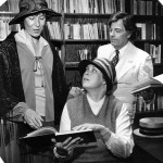 Little Shop Around the Corner April 1985 K Professors Margo Bosker Light (German), Gail Griffin (English), and Mark Thompson (Religion) rehearse a scene from the Little Shop Around the Corner for a Festival Playhouse "Readers Theatre" production in Spring 1985.