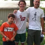 CPDOne Bret Linvill ’15 (center) during his summer internship, flanked by alumni supervisor Jerry Mechtenberg-Berrigan ’97 (right) and Jerry''s son, Amos.