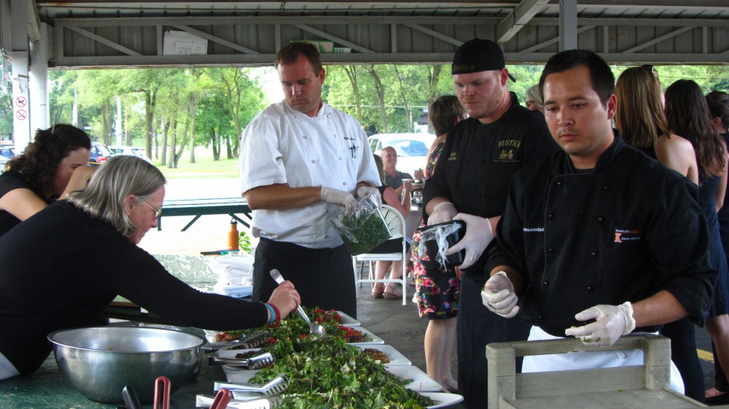 Chef James Chantanasombut (far right) assembles soybean and cabbage cake