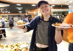 Student lifting plates during Cafsgiving