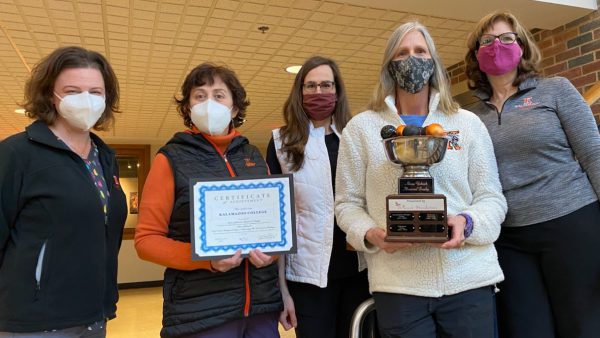 Student Health Center staff gathered with flu vaccine recognition awards