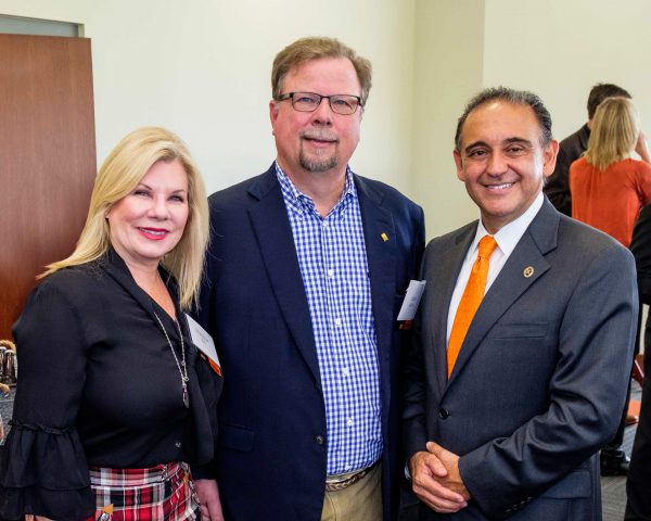 Commencement speaker Larry Bell with his wife, Shannon Bell, and President Jorge G. Gonzalez