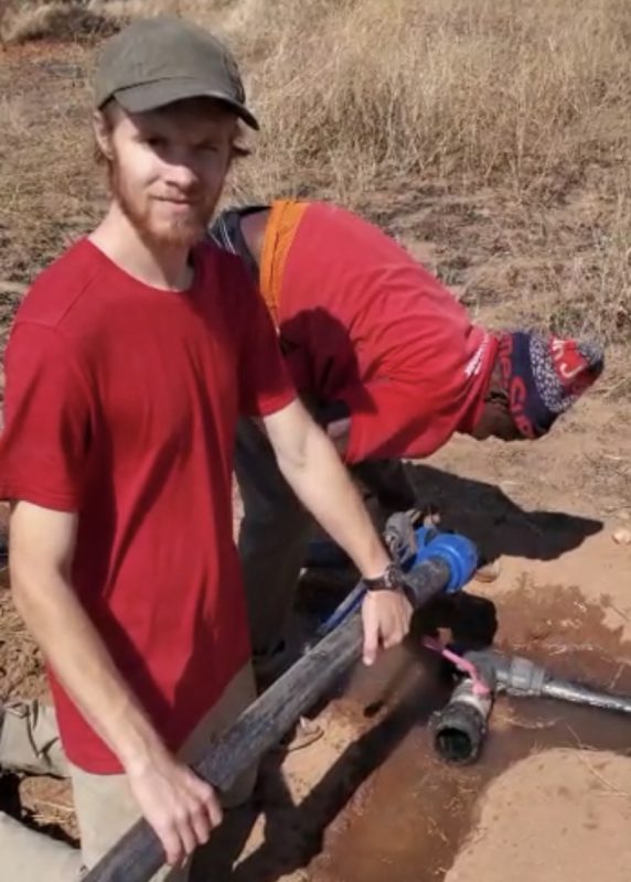 Sam Meyer with assistant and water pipes