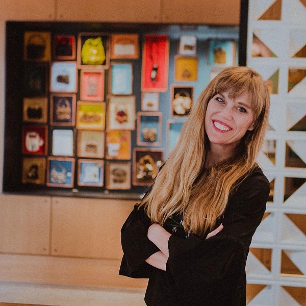 Heather Boersma standing in front of a display from COVID Purse Diary