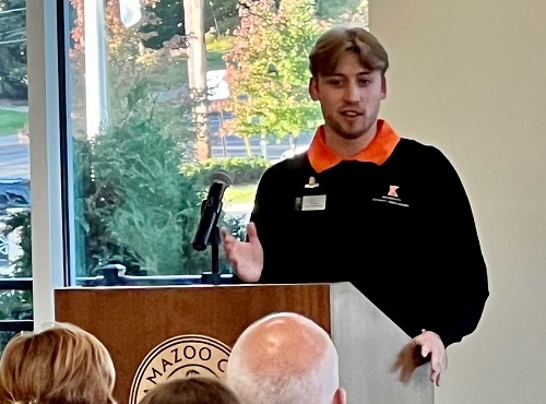 Senior Biology Major Nate Zona speaks at the Community Breakfast