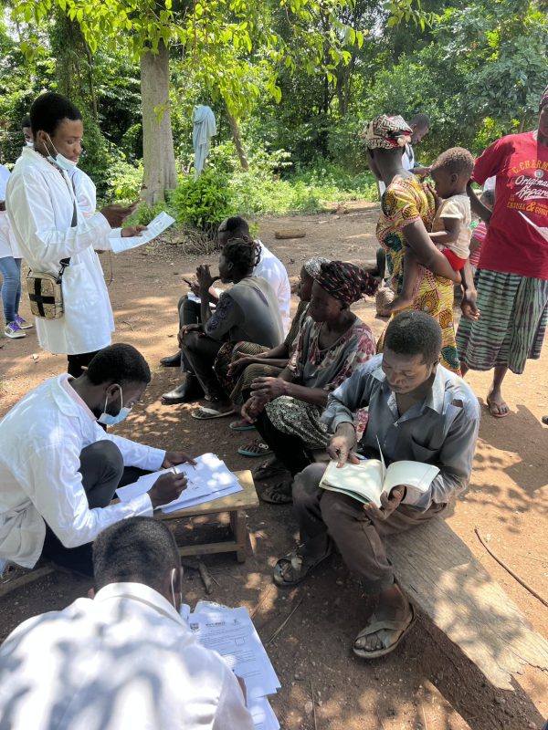 Researchers looking at books and forms to translate documents