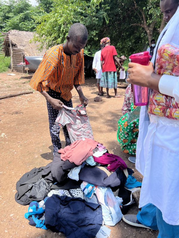 Picking out clothes from a pile