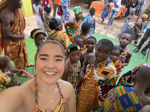 Rachel Kramer surrounded by children