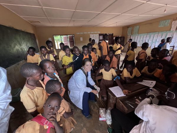 Rachel Kramer in a classroom full of children