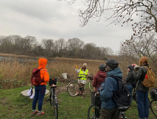 Students take a break from cycling to hear from an instructor