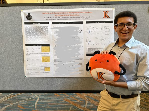 Frazier poses with Bippy at his poster presentation