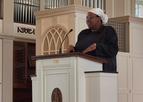 Milan Levy speaks from the Stetson Chapel lecturnlecturn