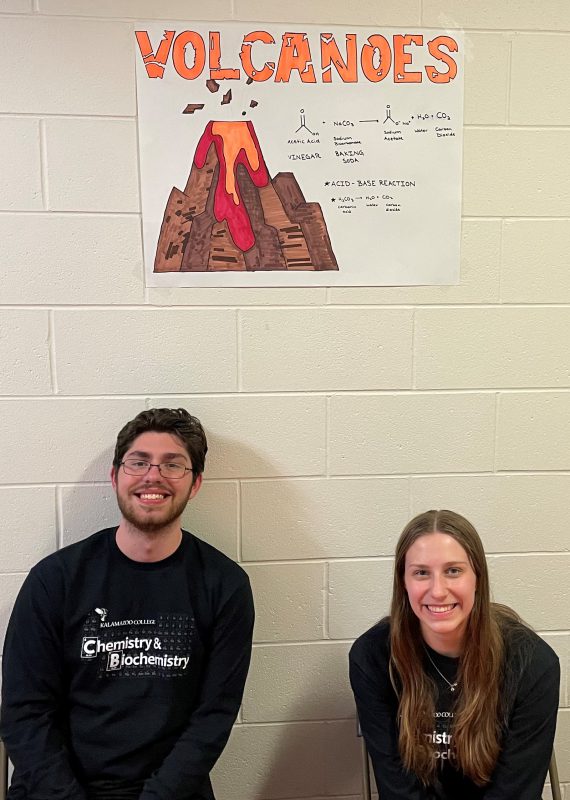 Students tend to a booth showing homemade volcanoes