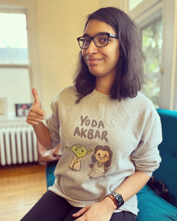 Sohini Pillai wears a sweatshirt that says Yoda Akbar