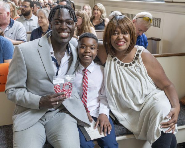 A student with his mom and brother at the senior awards