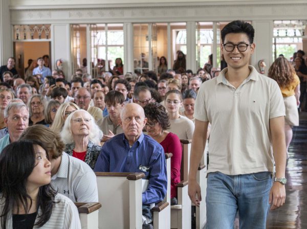 Students walks to the front of Stetson Chapel to receive a Senior Award