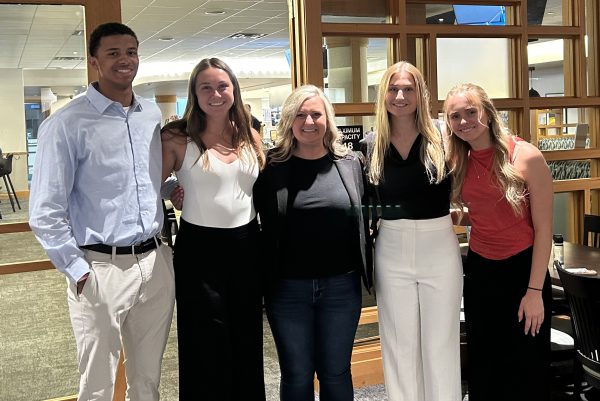 Four students with Executive Director of Human Resources Stephanie Farrell during job shadows