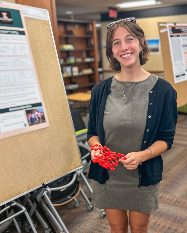 Bea Putman presents her chemistry summer research at the Upjohn Learning Center Commons