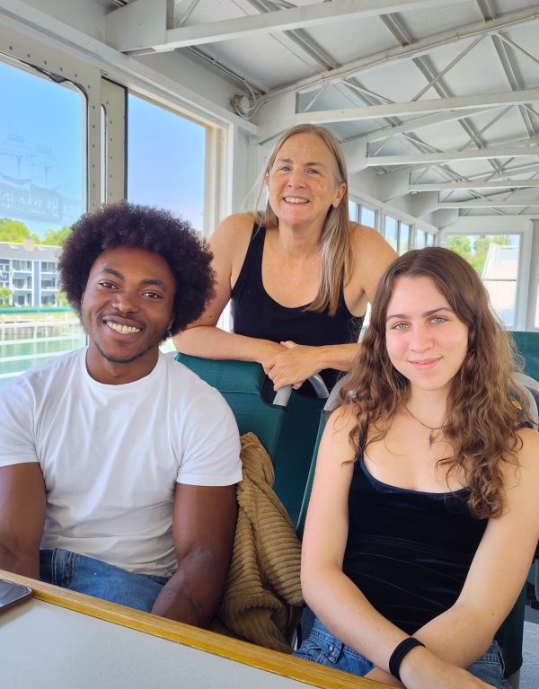 Three people on a ferry to Beaver Island