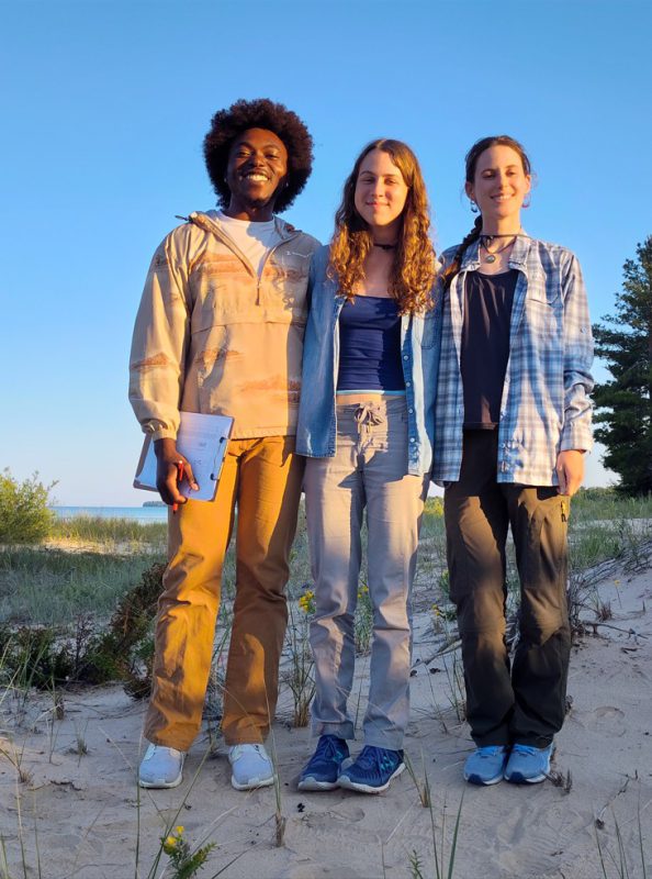 Three students research Pitcher's thistle on Beaver Island