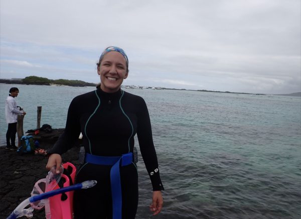 Student prepares to perform research in a wet suit