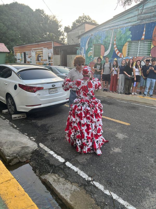 A resident of the Los Pepines neighborhood dances with Riley Shults '28