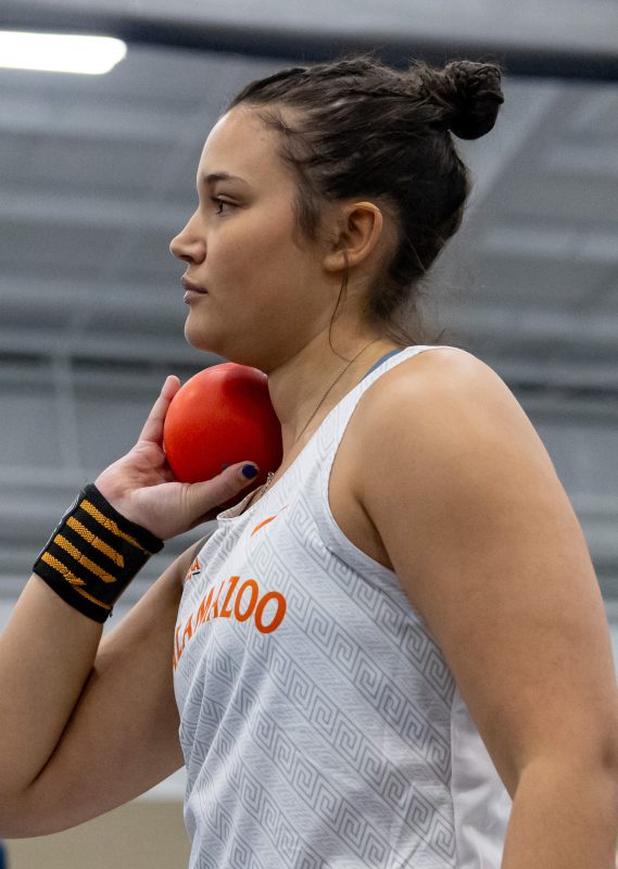 Track and field student-athlete Zara Strauss '29 prepares to compete in the shot put and set a new personal mark