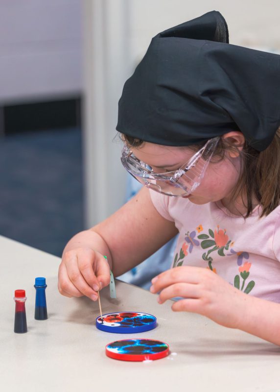 Kids performing experiments