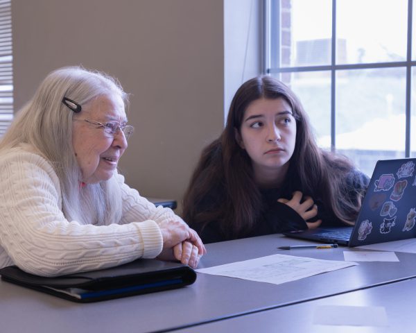 Students meet with Heritage residents in a Principles of Marketing class