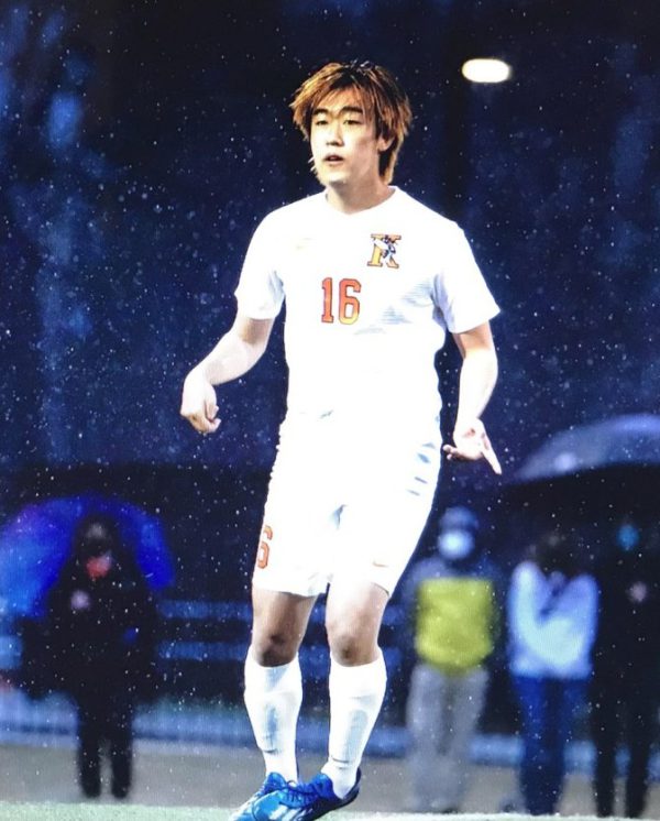 Shun Yonehara during a rainy Kalamazoo College men's soccer game