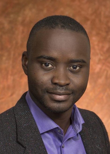 Portrait of 2026 tenure recipient Manfa Sonogo, scholarly, teaching excellence 