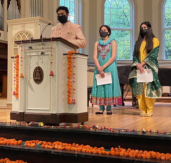 three Hindi students in the chapel decorated for Diwali