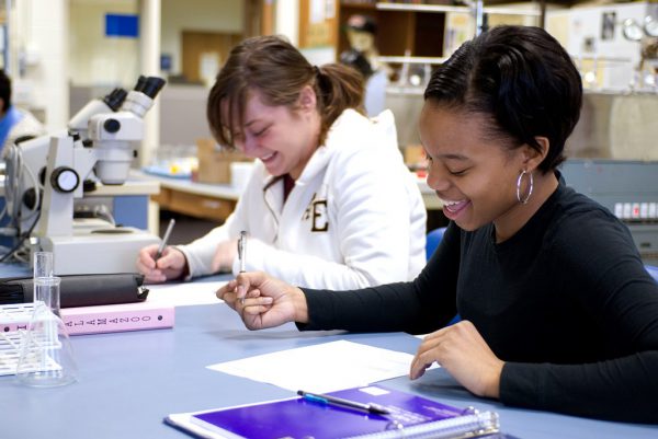 two students in a chemistry lab