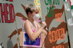 women, gender and sexuality studies student speaking at an on-campus protest