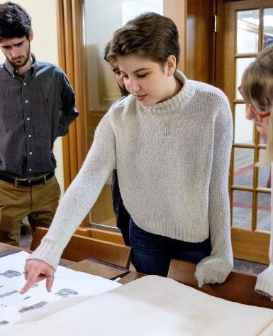 history students looking at archived records