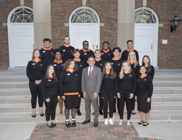 Photo of the 2022-2023 President's Student Ambassador with President Jorge G. Gonzalez on the Stetson Chapel patio.