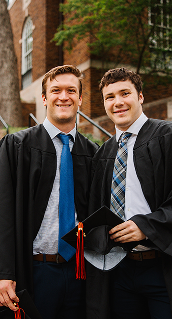 Two K students posing after graduation