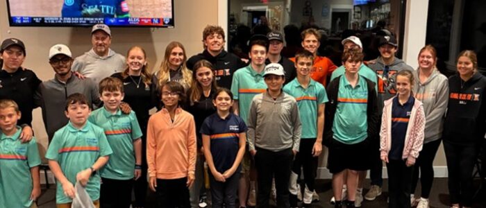 Golf PGA Jr. League A group of student-athletes and local children gathered at an event.
