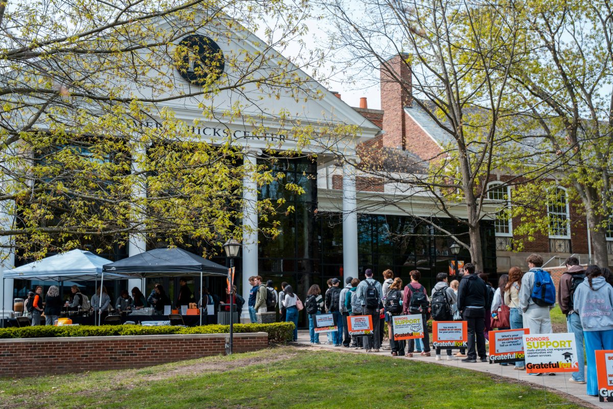 Many students in line in front of Weimer K. Hicks Student Center. 