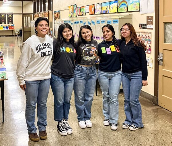 Five students working at El Sol Elementary School. 